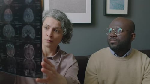 Doctor Explains Brain Scan to Concerned Patient at Home
