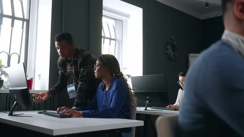 Manager is Teaching Novice Female Office Worker Black Man and Woman in International ITcompany