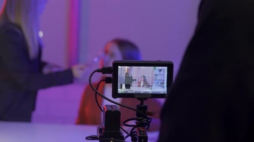 Woman Being Filmed in Studio Workplace