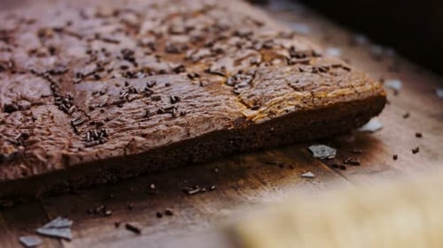 Delicious Chocolate Brownie Close Up on Wooden Surface