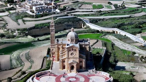 Majestic aerial view of Ta' Pinu National Shrine in Gozo Malta standing as a Romanesque masterpiece
