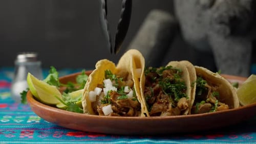 Delicious Tacos Garnished with Onions and Cilantro