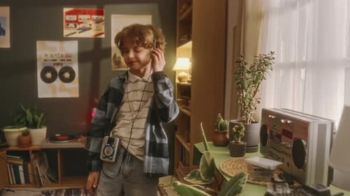 Boy Dancing in his Bedroom with Headphones