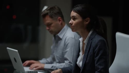 Candid creative busines man and woman discuss project in office. Medium shot