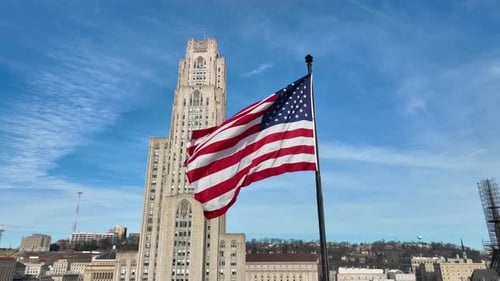 American Flag Waving in Cityscape