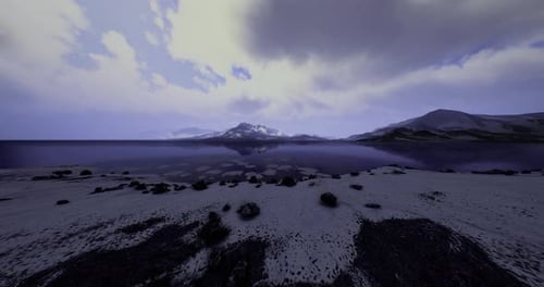 Majestic Mountains Reflected in Serene Lake During Twilight Hours