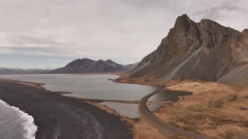 Drone view of Vestrahorn and Stokksnes beach with dramatic peaks and black sand coastline in Iceland
