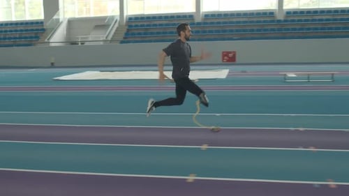 Sportsman Running on Blade at Indoor Stadium