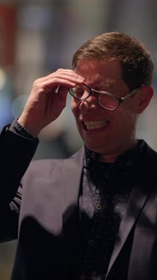 A Smiling Professional in a Modern Setting Radiating Positivity and Charm in Business Atmosphere