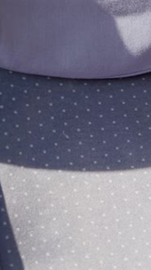 Detailed Close-Up of Modern Train Seat Fabric with Dot Pattern Design