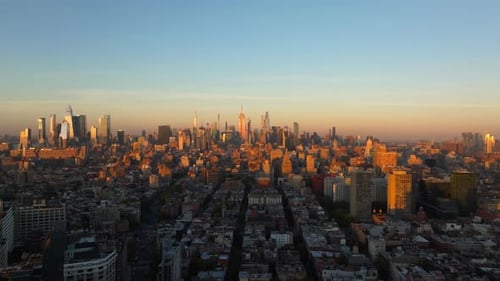 Warm Sunlight Envelops Midtown Manhattan and New York City Skyline Creating Elongated Shadows From