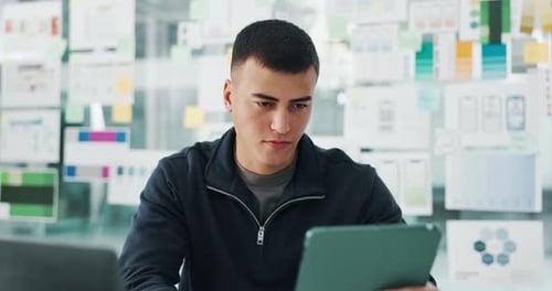 Creative, planning and man in office with tablet for ui designer, digital career and startup