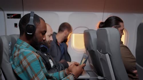 Passengers inside a commercial airplane during travel