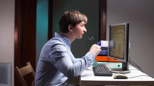 Stressed Office Worker Suffering From Headache and Eye Strain at Night