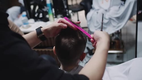 Child Getting Haircut in Modern Barbershop