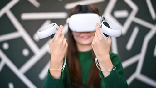 Woman Using Virtual Reality Headset with Controllers