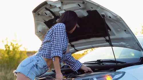 Breakdown or Broken Car on Road Young Woman Driver During Problem Car
