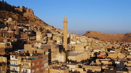 The Old City Of Mardin With Towering Minarets At Sunset In Turkey. Aerial