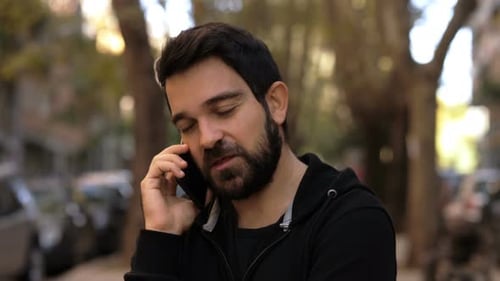 Man Talking on Smartphone in the City