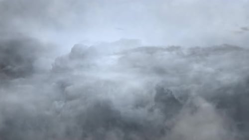 point of view Cumulus clouds of dark gray and thunderstorms move across the sky