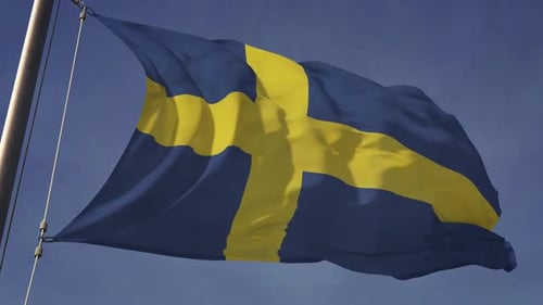Waving Flag of Sweden Against a Clear Blue Sky