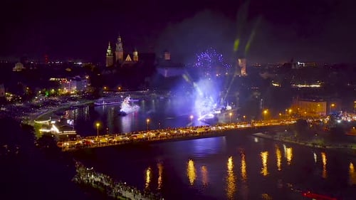 Fireworks over Wawel Royal Castle and Vistula river in Krakow during Dragon Parade, Poland.