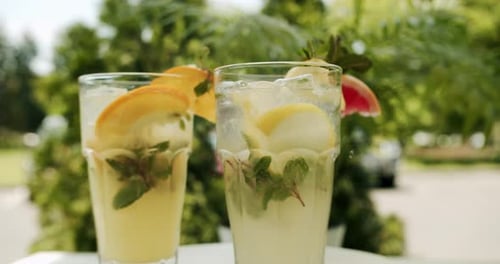 Refreshing Citrus Drinks with Mint in Tropical Setting
