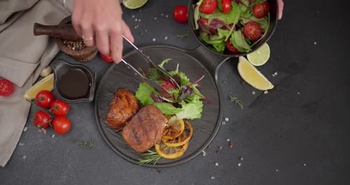 Serving Fresh Salad and Grilled Meat on Plate