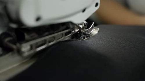 Close Up of Sewing Machine Stitching Black Fabric