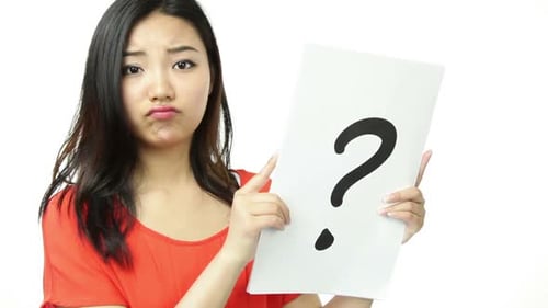 Attractive woman from east asia in her 20s isolated in studio