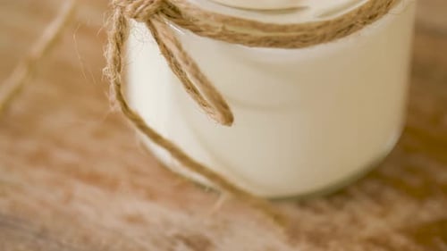 Food and Dairy Products Concept - Close Up of Homemade Yogurt Or