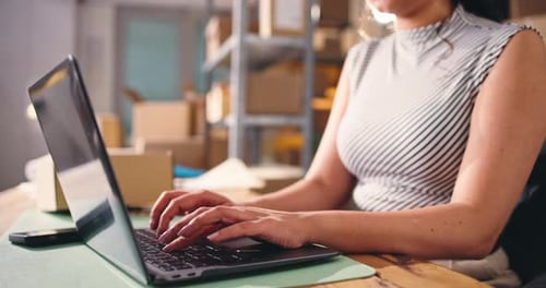 Small business, hands or laptop in warehouse for ecommerce, review site or answer order query