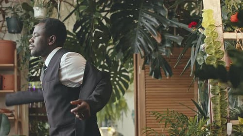 Black Man Putting on Wedding Suit
