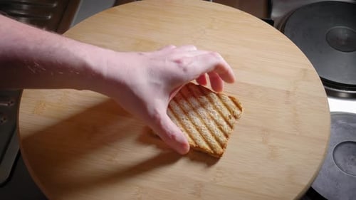 Slices of toast are place on a wooden platter - Steady Shot