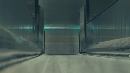 A Shot Of End Of An Downwards Moving Escalator In The Subway Station Of Stockholm,Sweden TILT UP At