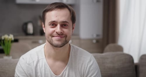 Man Talking and Smiling in Home Setting