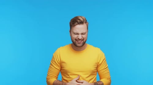Expressive Young Man Over Vibrant Background Studio Portrait of Handsome Person