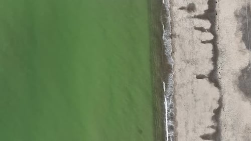 Sandy neck beach with clear green water and sandy shore in cape cod, massachusetts, aerial view