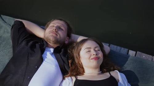 Couple Lying Together by the Water