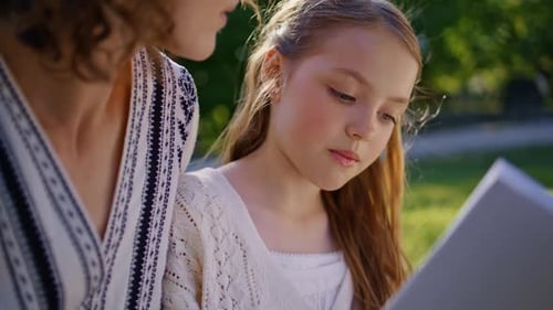 Little Child Reading Fairytale for Mom in Park Closeup Parent Kid Enjoying Book