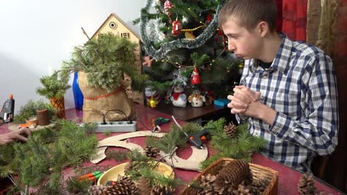 Teen Crafting Christmas Wreath at Home