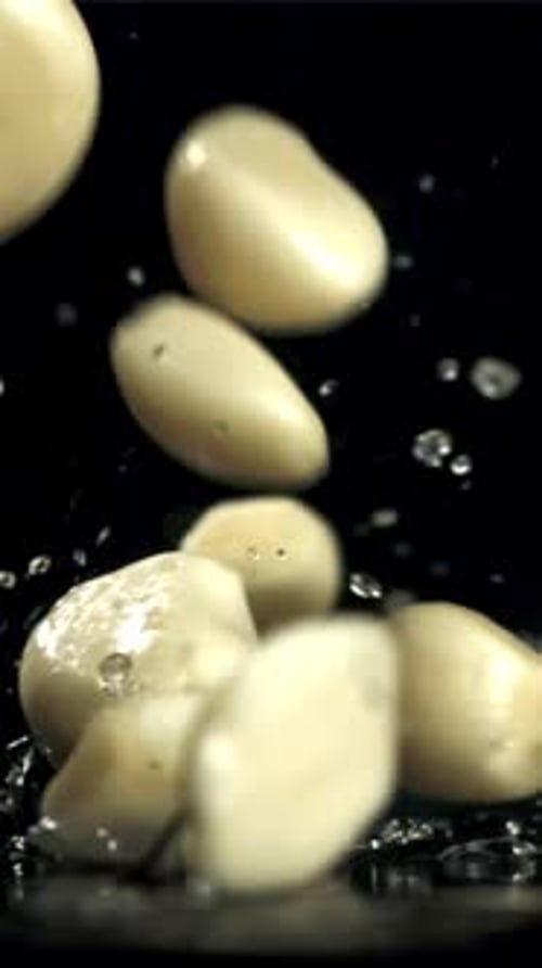 Fresh Garlic Falls on the Table Macro Shot Filmed on a Highspeed Camera at 1000 Fps