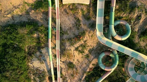 Colorful Water Sliders At Playground Park In Pontevedra, Spain. aerial topdown shot