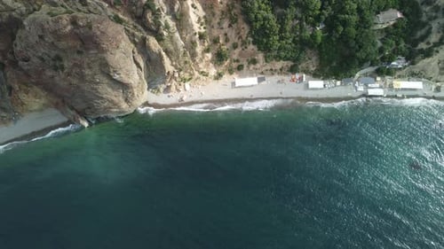 Aerial View on Calm Azure Sea and Volcanic Rocky Shores Small Waves on Water Surface Nature Summer
