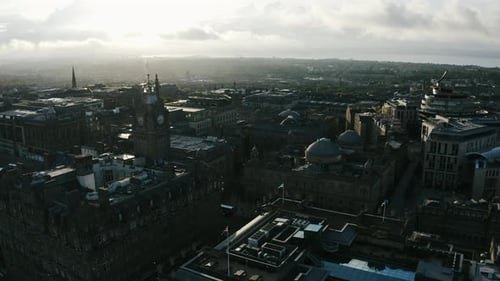 Establishing drone shot of Edinburgh, Scotland at sunset.