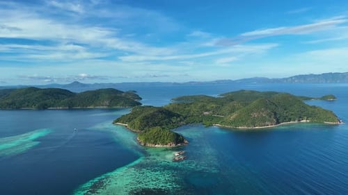 Aerial drone shot of various small island in coron palawan with blue turquoise water