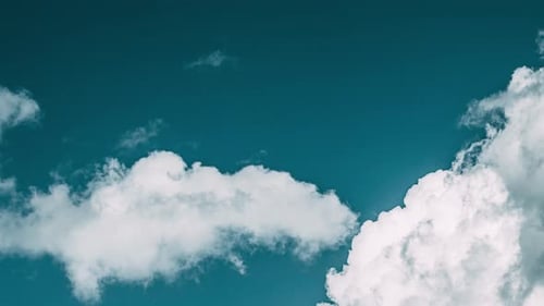 Fluffy White Clouds Time Lapse over Blue Sky