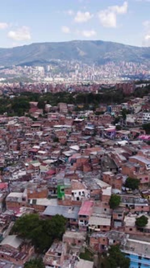 Aerial view of Comuna 13, San Javier, reveals colorful houses and urban density in Medellin