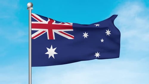 Waving Australian National Flag on a Pole Against Blue Sky