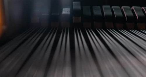Inside Piano Showing Hammers Hitting Strings Close-Up